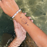 Tatuaje Concha y Estrellas