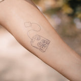 Tatuaje Bolsa de Té con Smileys