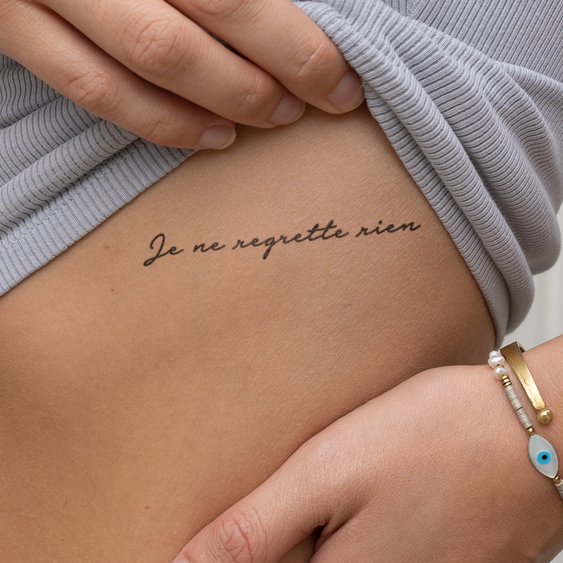 Tatuaje Frase "Je ne regrette rien"